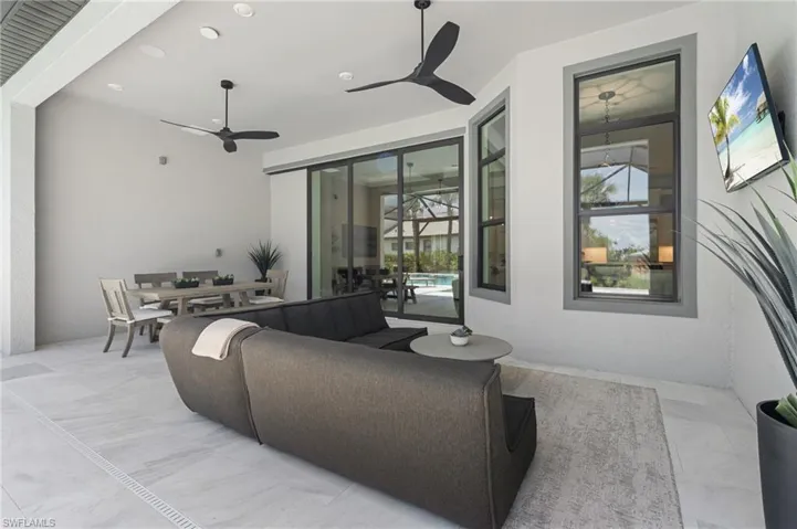 View of patio / terrace featuring outdoor dining space and ceiling fan