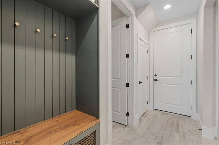Mudroom with recessed lighting and baseboards