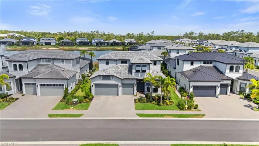 Birds eye view of property featuring a residential view and a water view