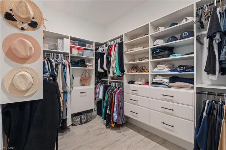 Walk in closet featuring light wood-style flooring