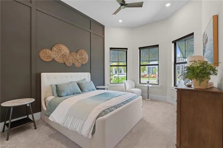 Bedroom featuring recessed lighting, ceiling fan, light carpet, and baseboards