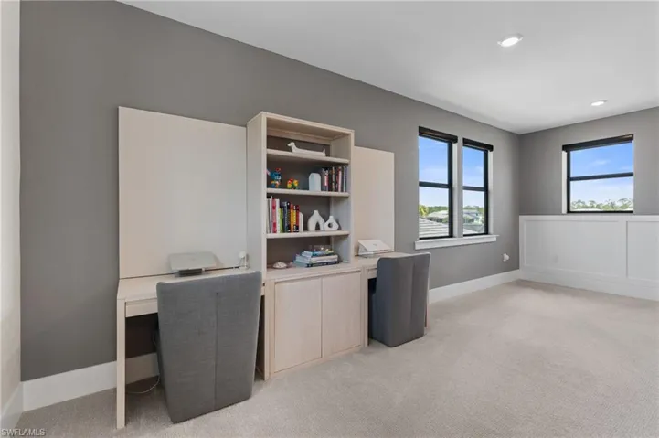 Office space with light colored carpet, recessed lighting, and baseboards