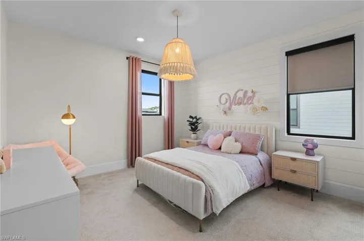 Bedroom with recessed lighting, light colored carpet, and baseboards