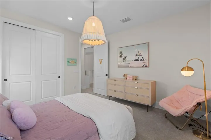 Bedroom with recessed lighting, a closet, visible vents, and carpet
