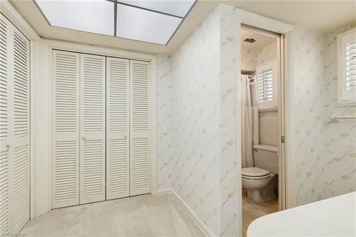 Bathroom with toilet and a closet