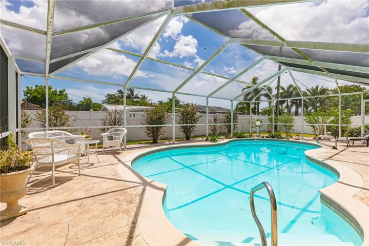 View of pool with a fenced backyard and a patio