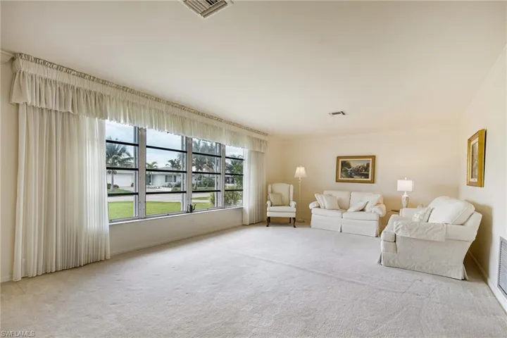 Living area featuring carpet flooring