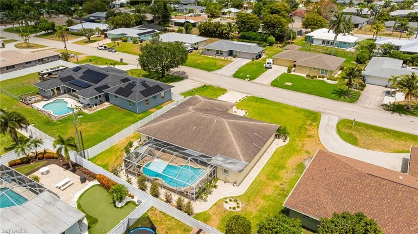 Aerial perspective of suburban area with a pool area