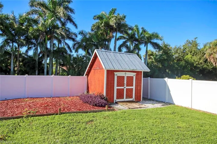 View of shed featuring a fenced backyard