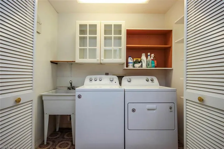 Washroom featuring separate washer and dryer