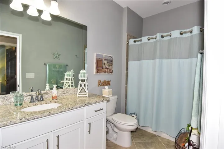 Guest bath has a tub/shower combo