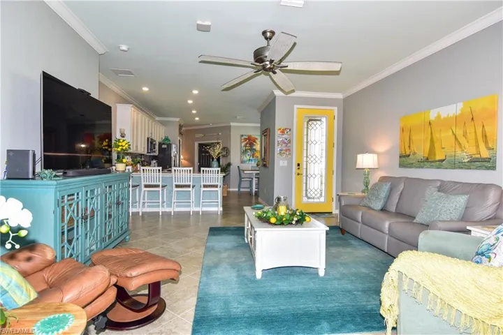 The open floor plan seamlessly integrates living spaces, creating a spacious and inviting environment.