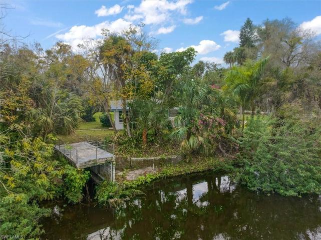Concrete dock offers small boat storage underneath.