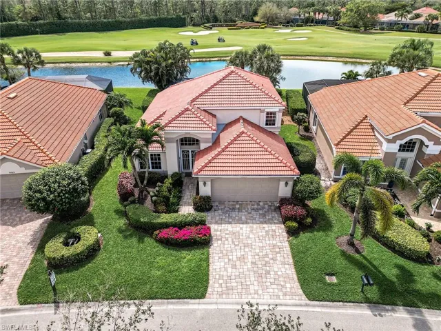 Aerial view featuring view of golf course and a water view
