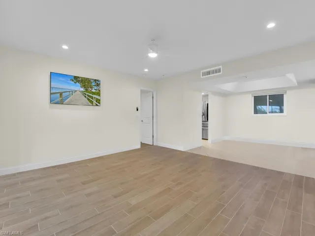 Living room with ceiling fan and tile floor