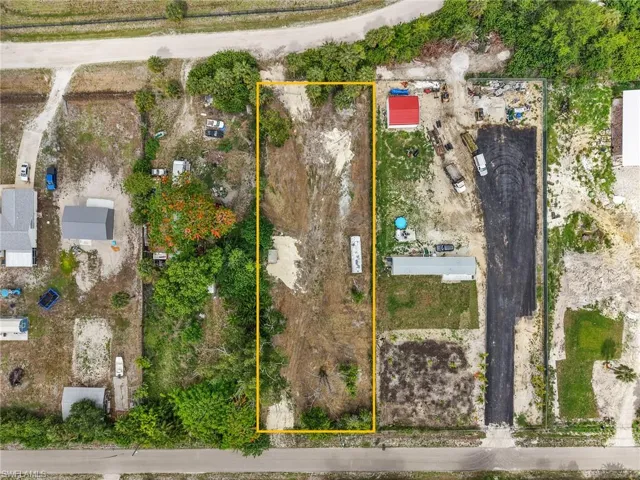 Expansive undeveloped parcel featuring a cleared central area