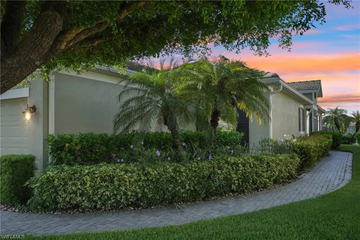Property exterior at dusk with a garage