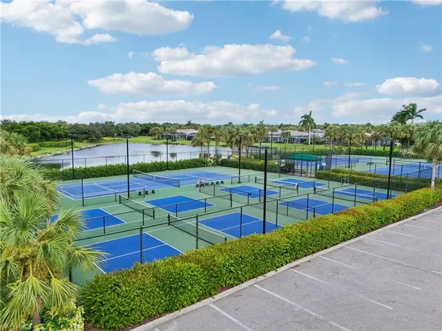 View of sport court with a water view