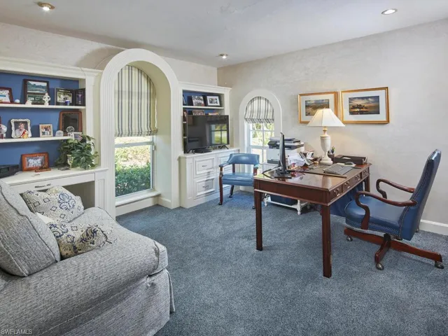 Fourth bedroom with en suite bathroom, currently being utilized as an office.