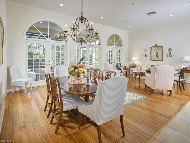 The dining/living area open to the lanai and pool.