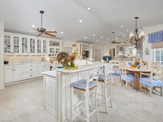 The kitchen provides a great deal of space, an informal dining spot and so much storage.