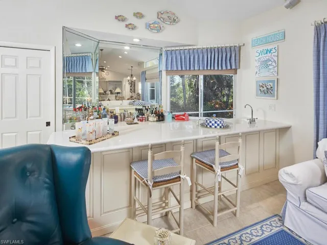 Prepare a drink at the bar in the family room. This will be your "happy"-est hour!