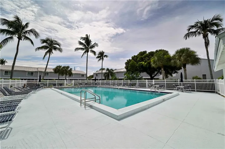 Community pool featuring a patio