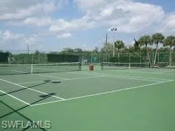 View of tennis court with community basketball court