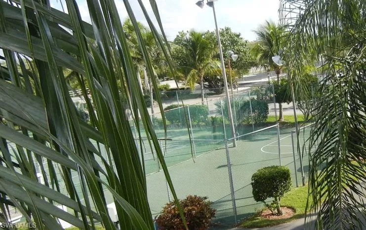 View of basketball court with a tennis court and community basketball court