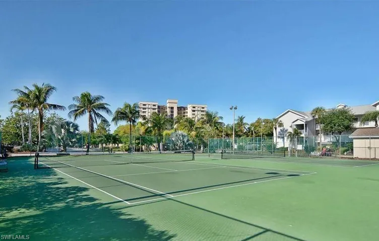 View of tennis court with community basketball court