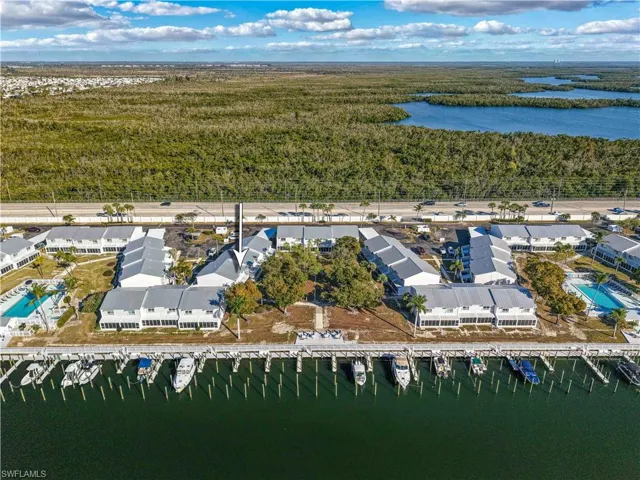 Aerial view of a large body of water and a heavily wooded area