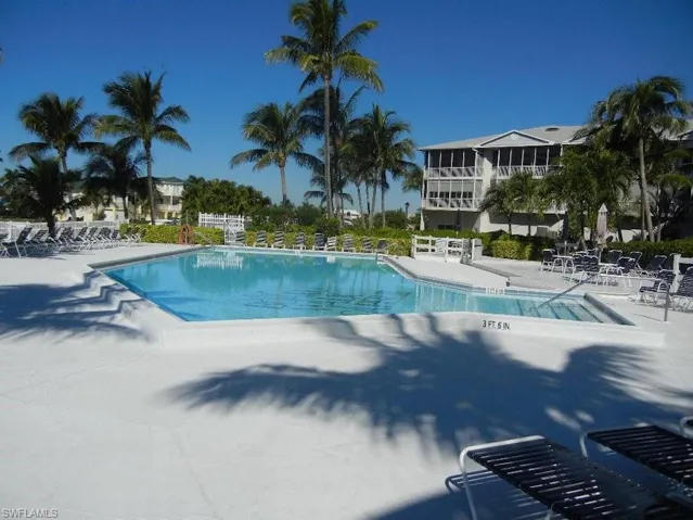 Community pool with a patio