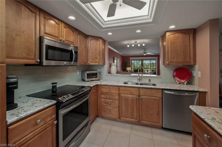 Quartz counter tops and larger pass through to dining area