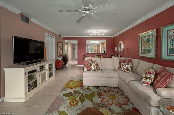 Tastefully decorated living area with closet