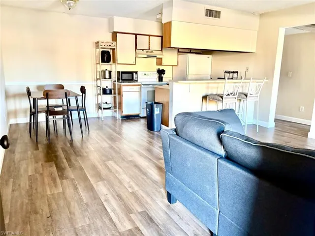 Living area featuring light wood-style flooring