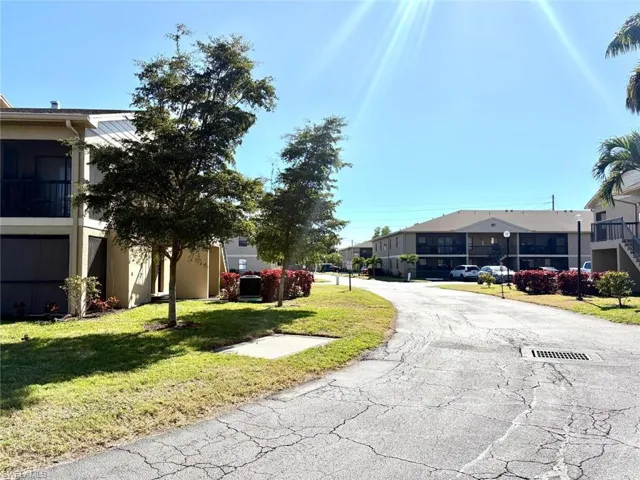 View of asphalt street with a residential view