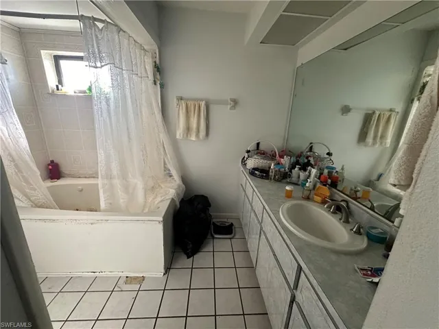 Bathroom with tile flooring and oversized vanity