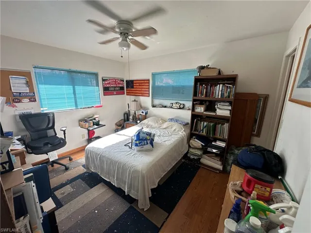 Bedroom featuring wood-type flooring and ceiling fan