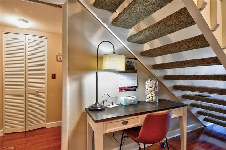 Home office featuring dark hardwood / wood-style flooring