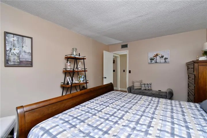 Bedroom featuring a textured ceiling