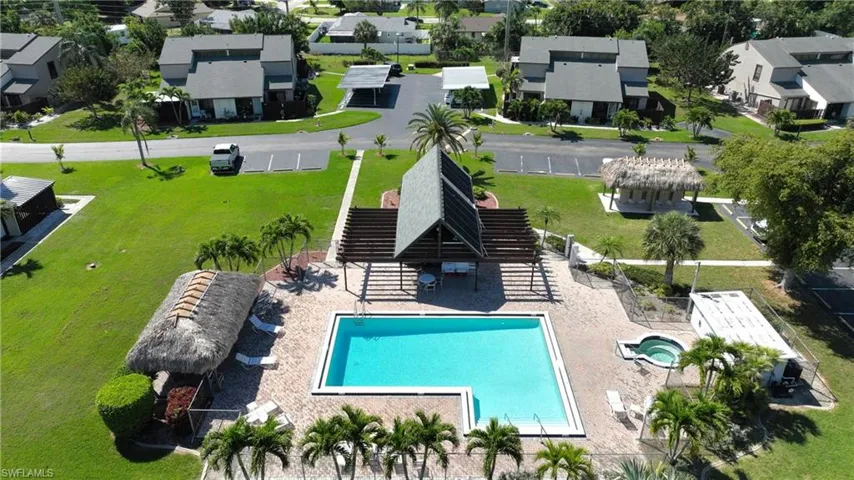 View of swimming pool with a patio and a lawn