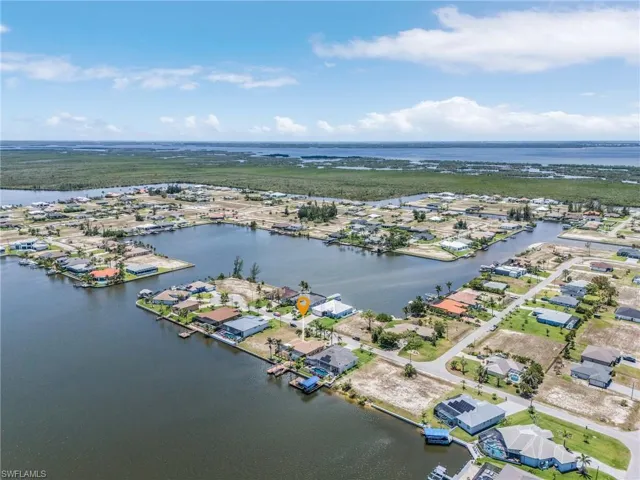 Aerial view of residential area with a large body of water