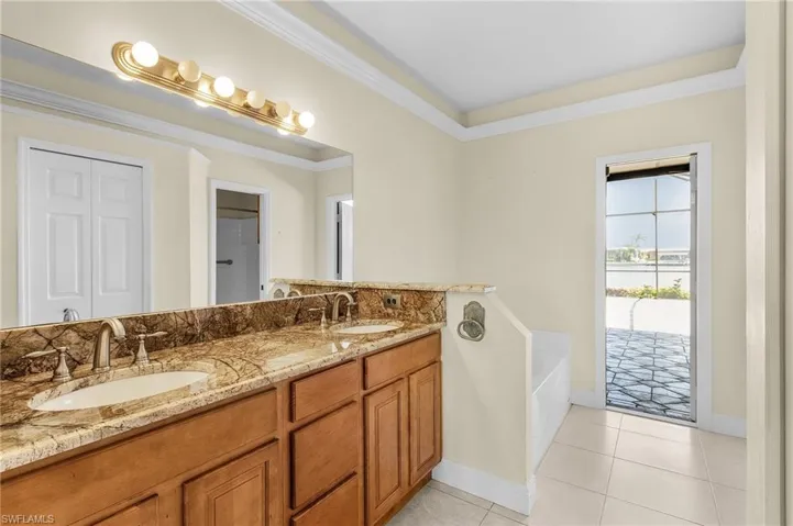 Bathroom with a garden tub, double vanity, pool bath