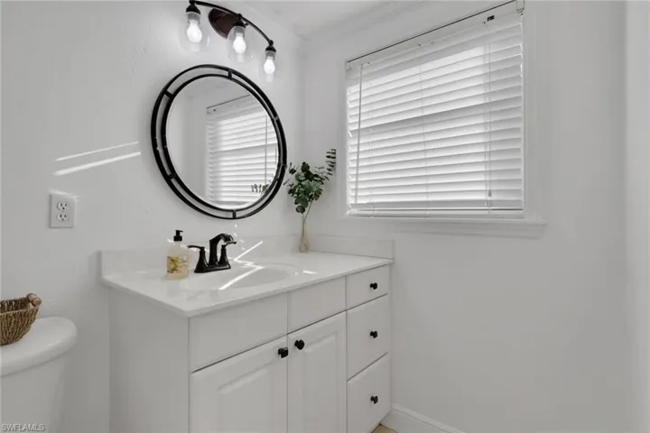 Bathroom with vanity and toilet