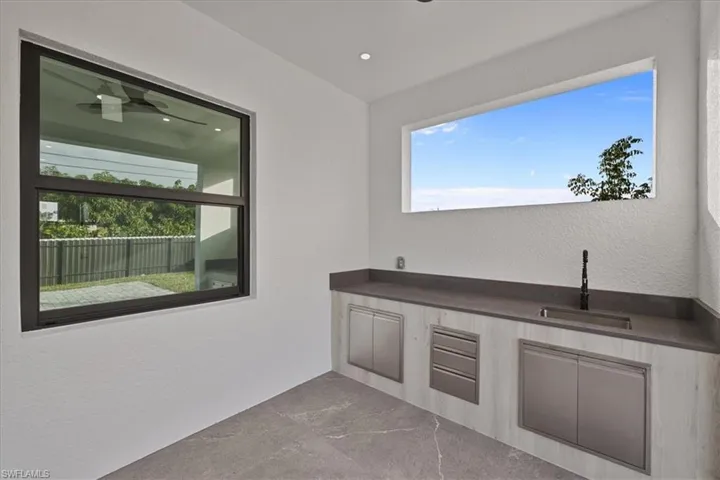 View of patio / terrace featuring area for grilling and a sink