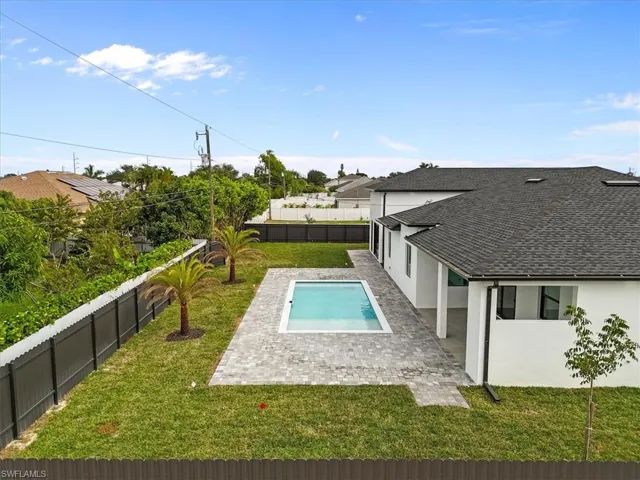View of pool featuring a patio area and a fenced backyard