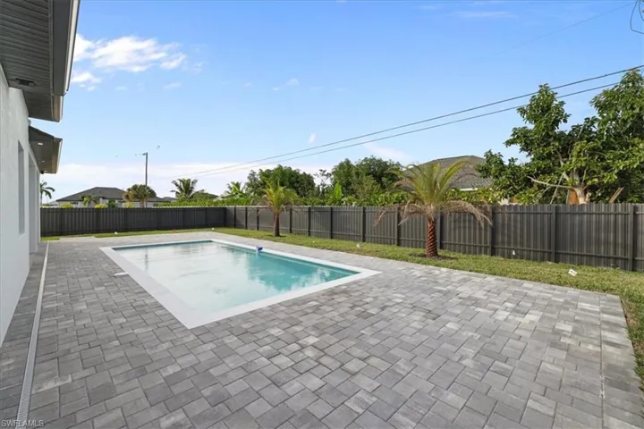 View of pool featuring a patio and a fenced backyard