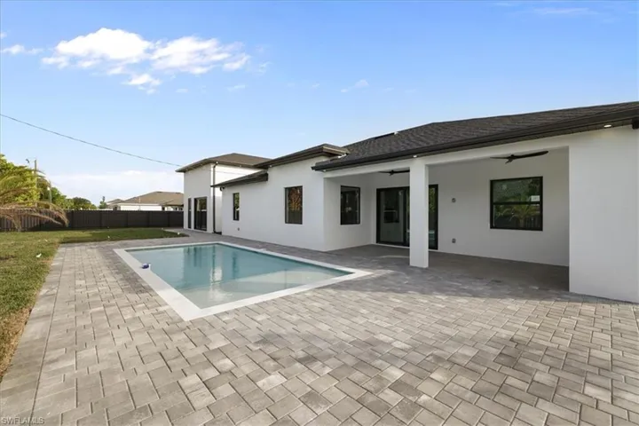 View of pool with a patio and a fenced backyard
