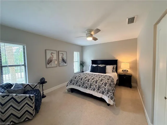 Bedroom with carpet and ceiling fan