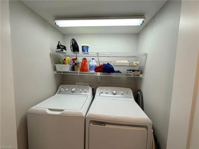 Laundry area featuring independent washer and dryer